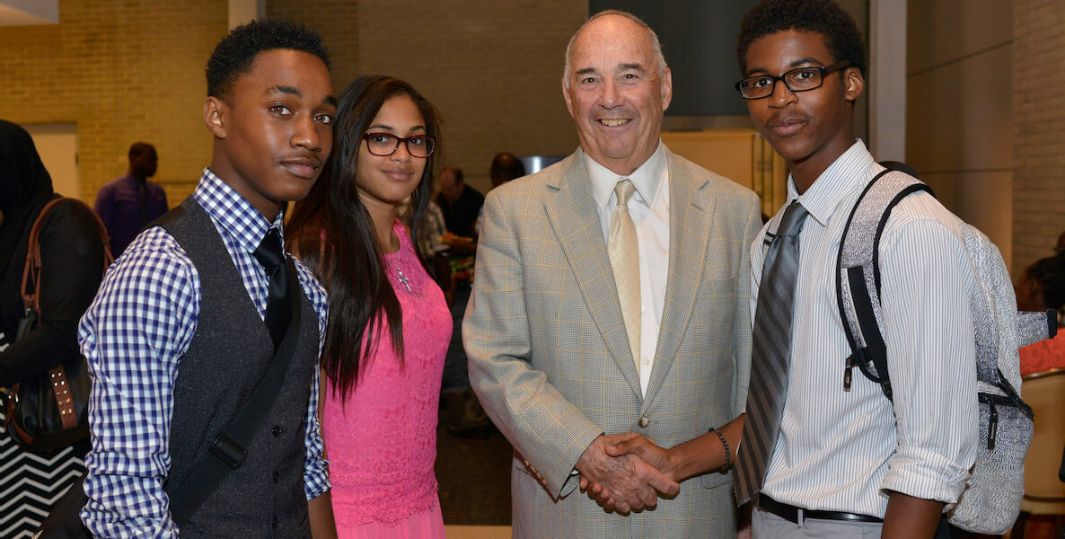 Ed Satell, veteran entrepreneur and founder of the Satell Institute, shakes hands with youth in Philadelphia