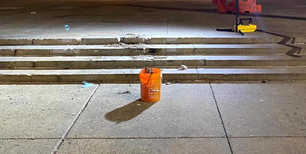 An orange bucket sits in the place formerly occupied by the frank rizzo statue in Philadelphia.