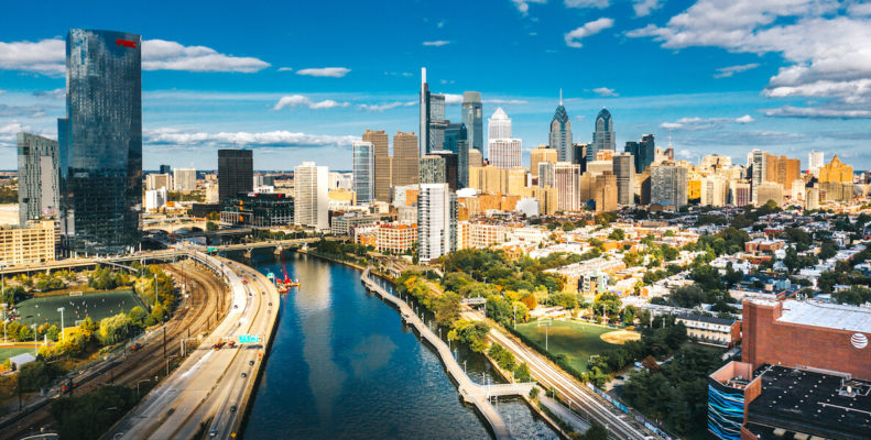 Philadelphia skyline in 2020 shows both Comcast buildings and the Schuylkill River