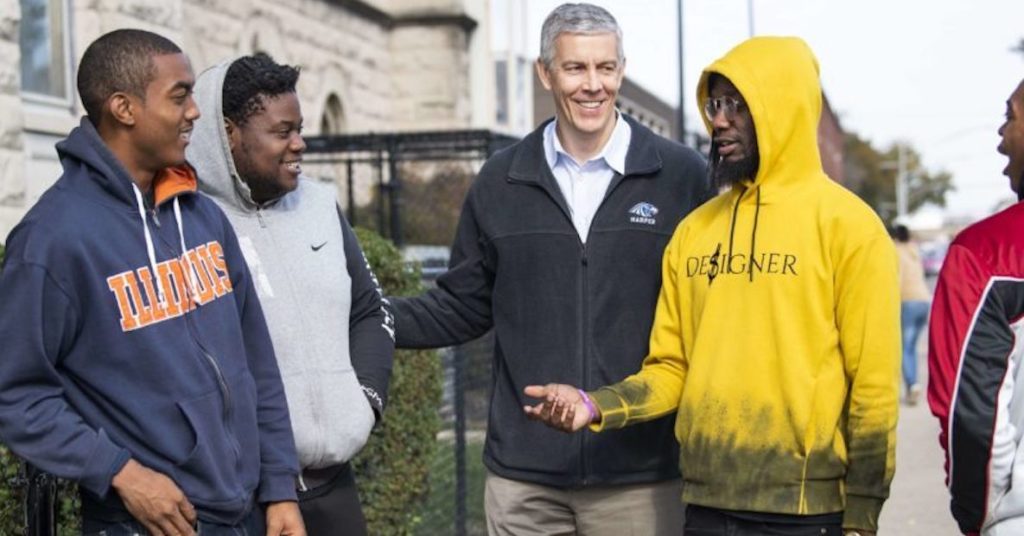Arne Duncan, middle, with some CRED participants in Chicago