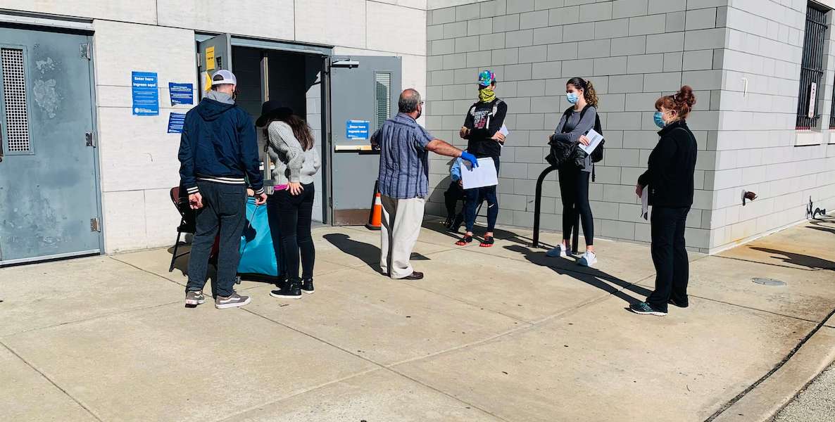 Voters line up outside a satellite election office in South Philadelphia