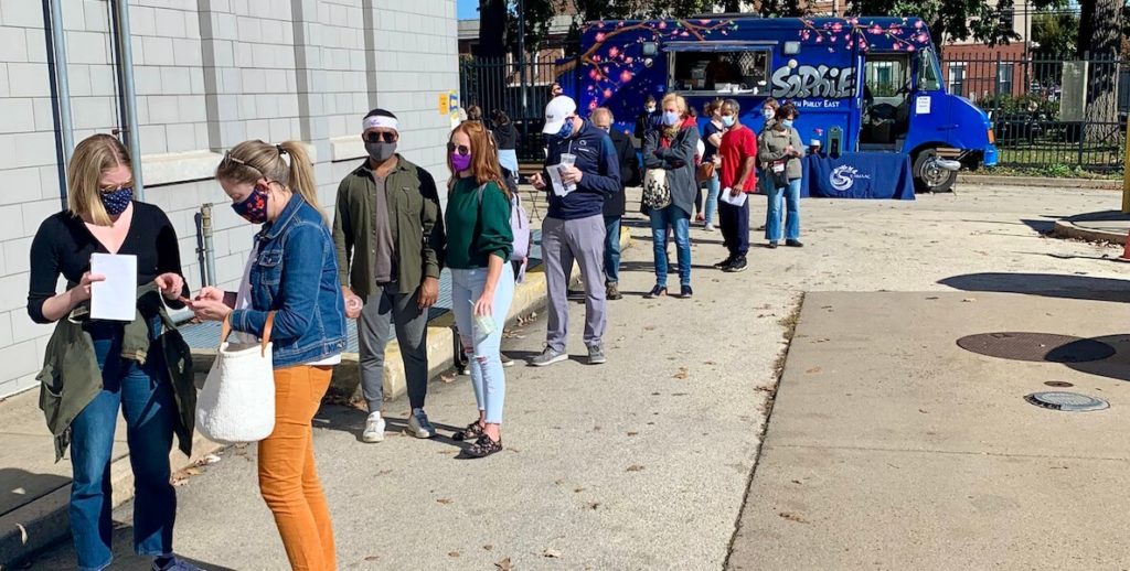 Philadelphia voters line up outside a satellite election office in South Philadelphia