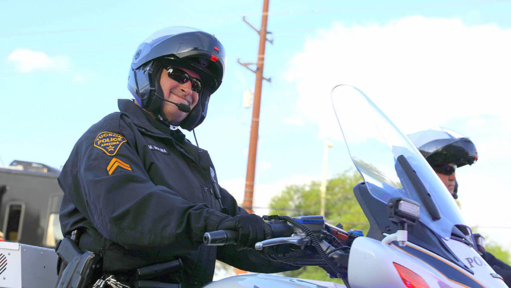 A policeman smiles at the camera in Tucson, Arizona
