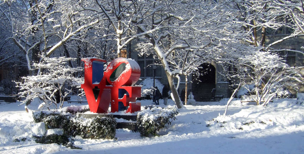 A snow-covered LOVE sculpture on the Penn campus in University City Philadelphia