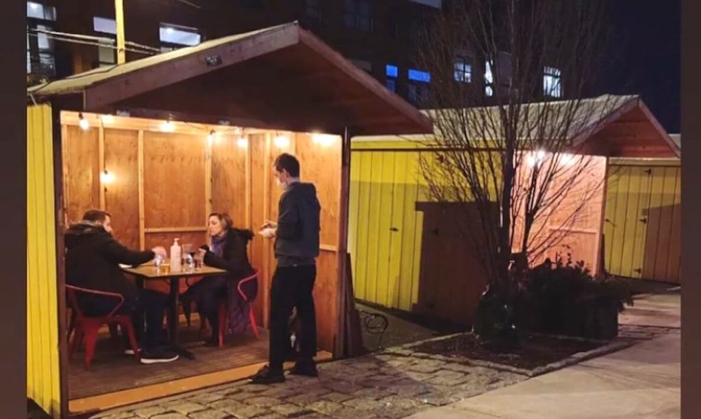 Outdoor seating in cabins at Bar Hygge in Philadelphia