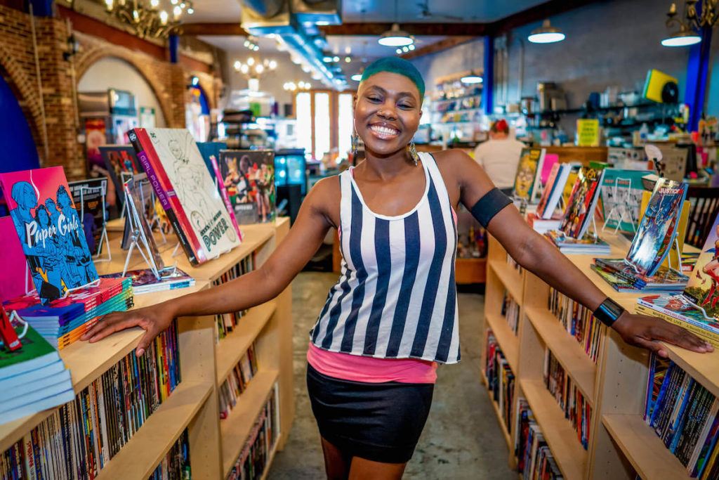 Ariell Johnson, founder of Amalgam Comics, poses in her shop