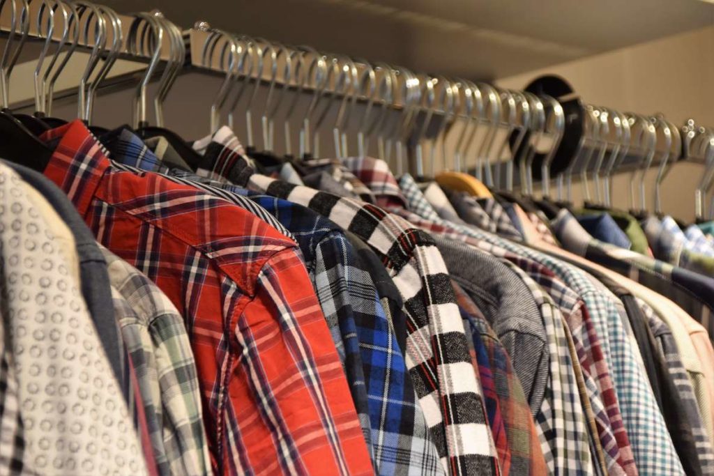 A rack of men's flannel shirts in all colors