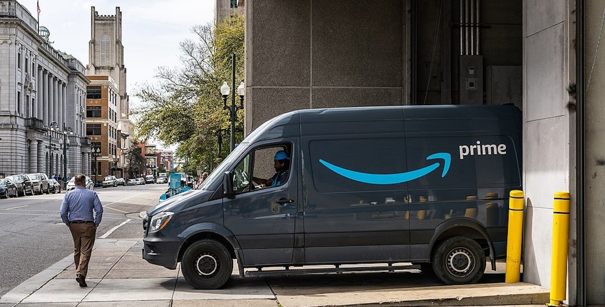 Amazon Prime van pulling out of driveway in city