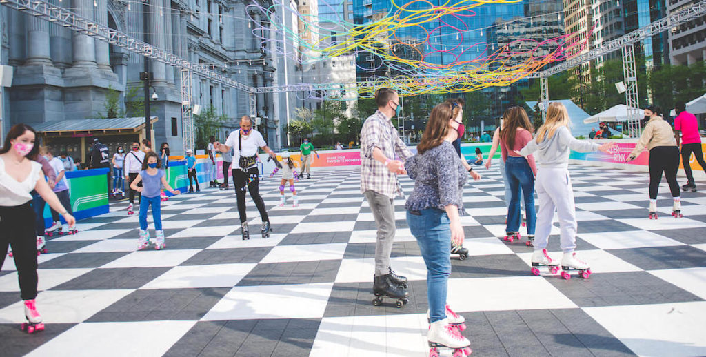 Locals skate at the outdoor roller rink at Philadelphia City Hall