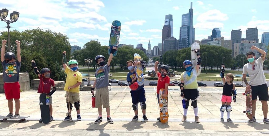 kids with skateboards standing on the Philadelphia Museum of Art steps