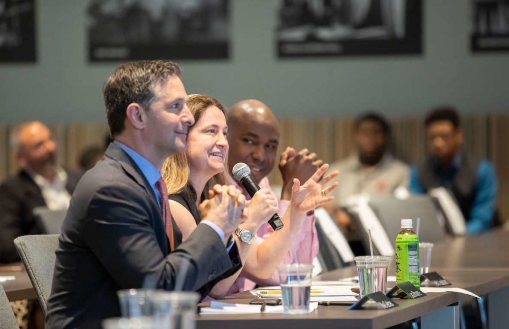 The judges panel at a pitch-style competition during a course with FS Foundation called Financial Scholars Program