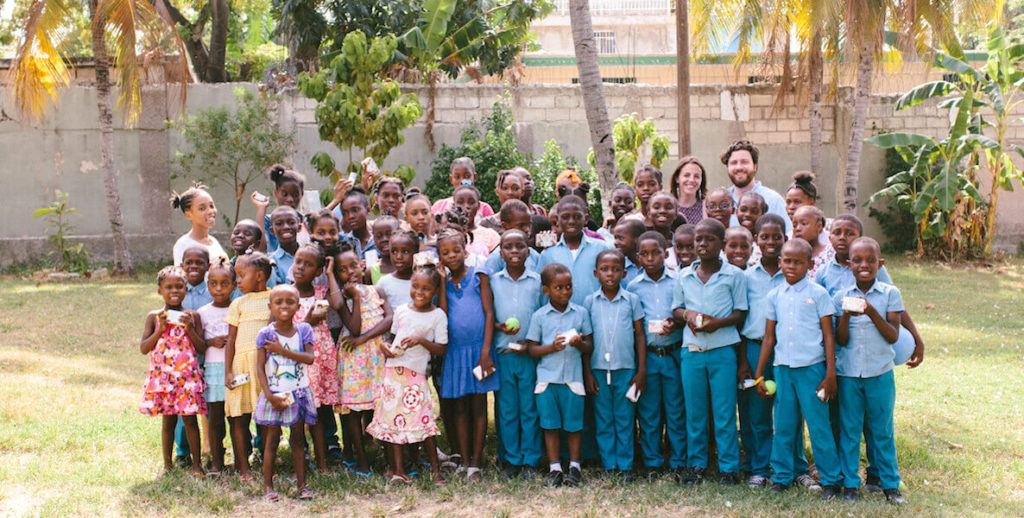 Hand in Hand founders with beneficiaries in Haiti