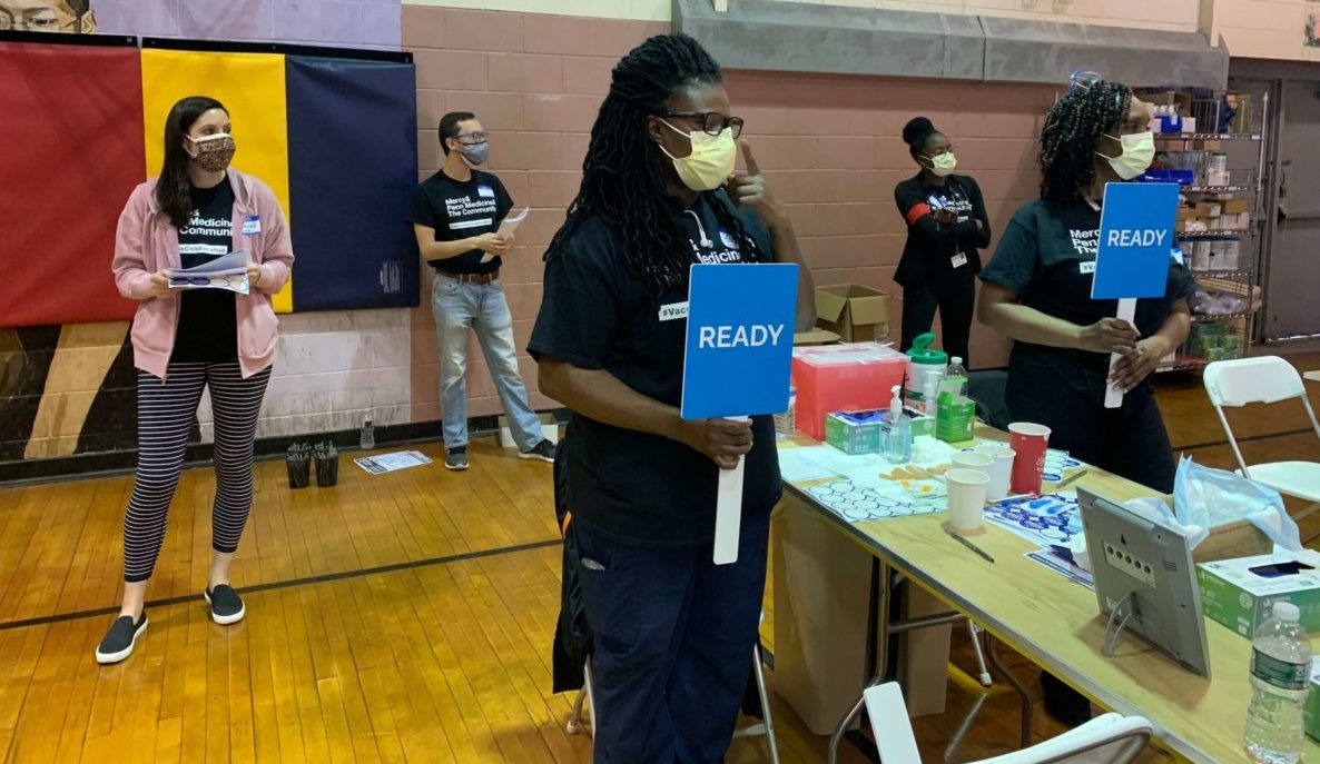 Clinicians ready to vaccinate patients in a clinic at a Southwest Philly rec center