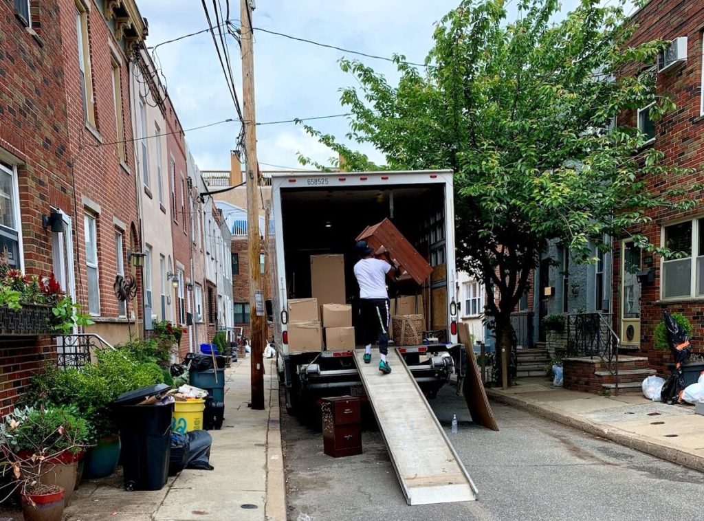 Movers load up a moving truck in South Philadelphia