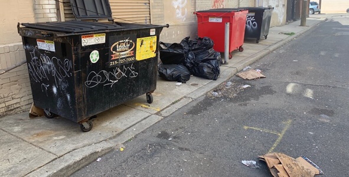 dumpsters and piles of trash on South Watts Philadelphia