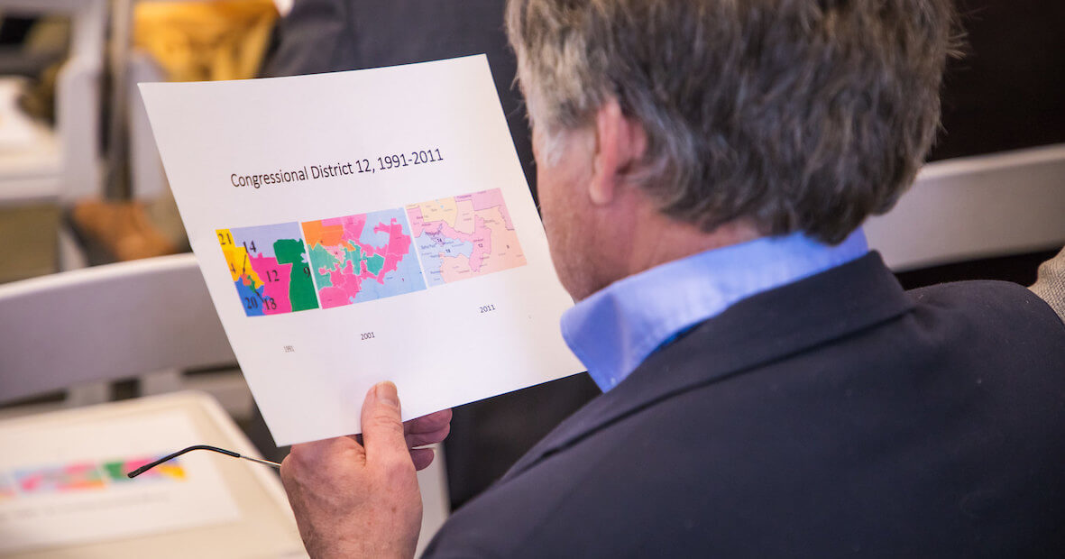 Man holding map of Pennsylvania districts