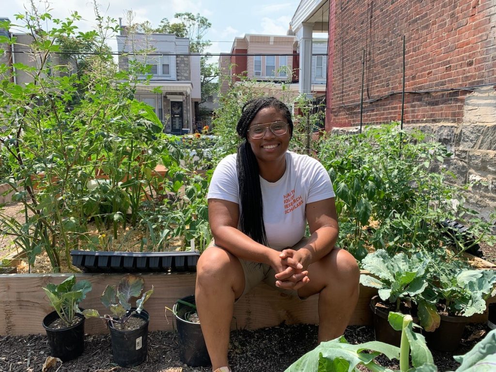 Ashley Gripper, founder of Land Based Jawns in the vacant lot-turned garden oasis in Cobbs Creek Philadelphia