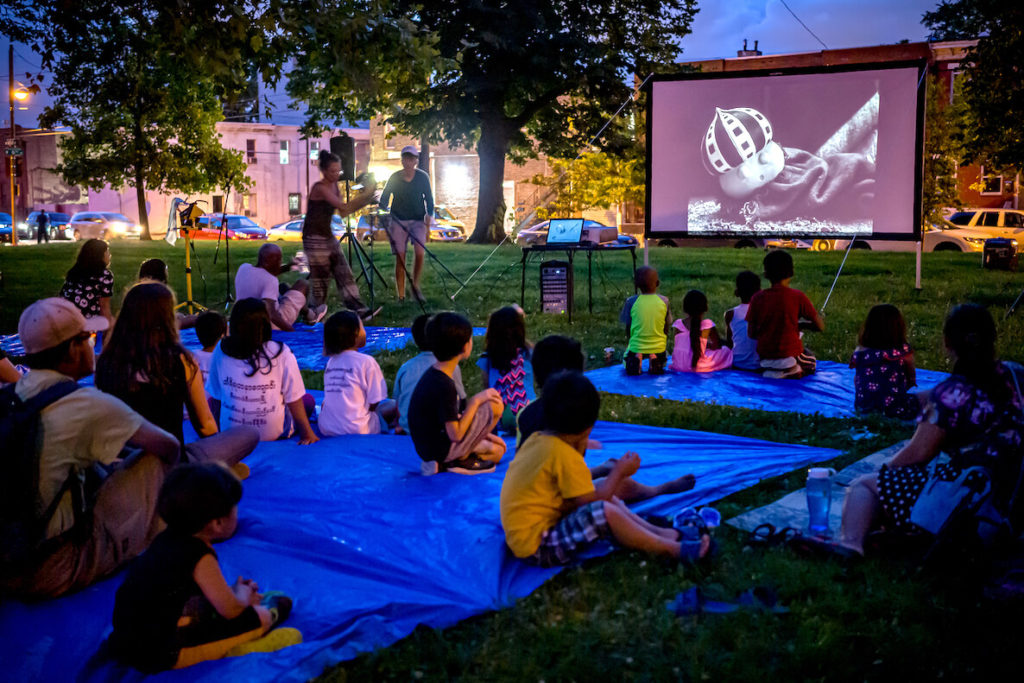 Guests enjoy outdoor film screenings during Scribe Video Center's annual Street Movies series in Philadelphia