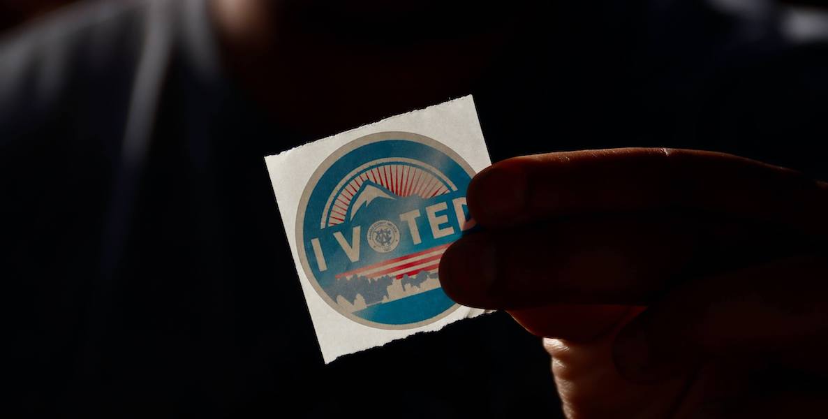 This photo of a voting sticker accompanies a voter guide