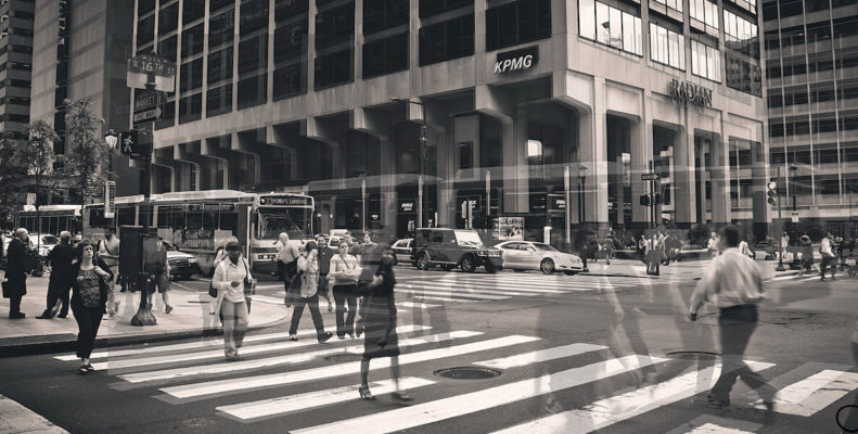 This photo of traffic and bikers at a traffic light accompanies an article about the failure to reduce pedestrian deaths in Philadelphia