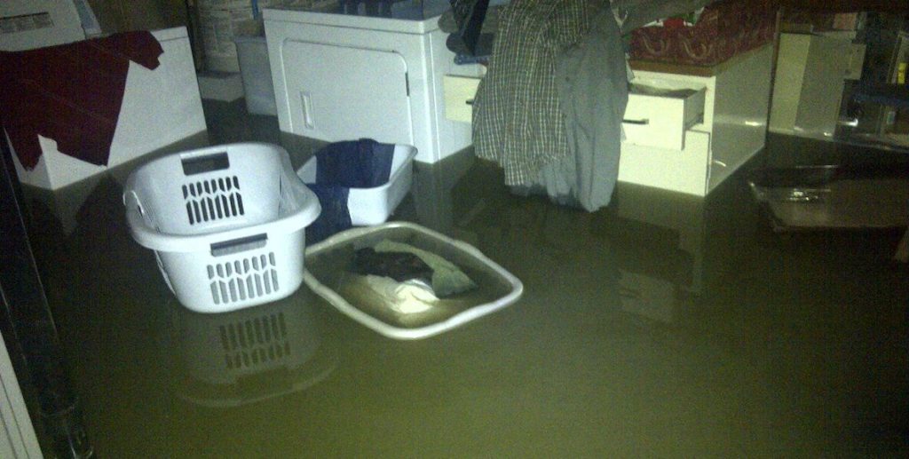 Flooded Basement with floating laundry basket