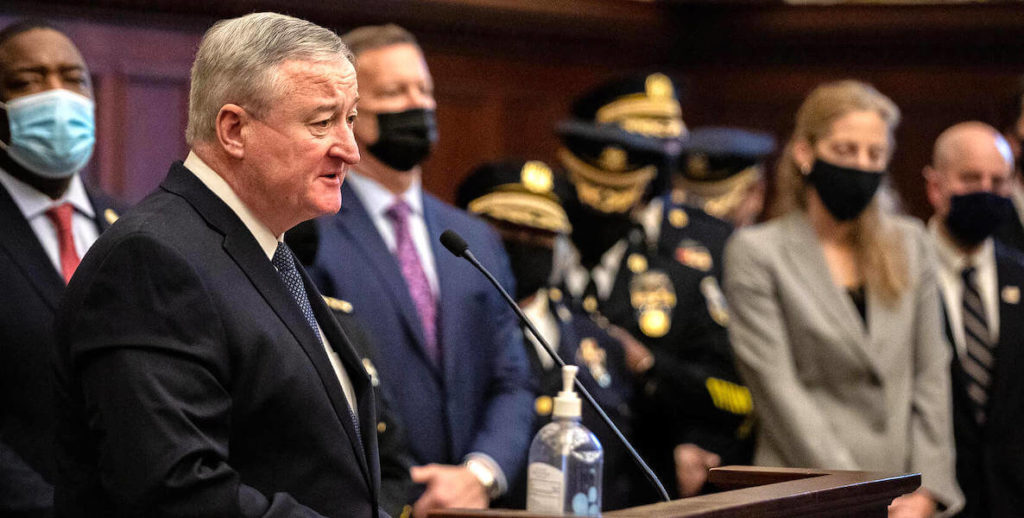 This photo of Jim Kenney at a conference on gun violence accompanies a piece about Philadelphia's inability to curb the murder epidemic in the city.