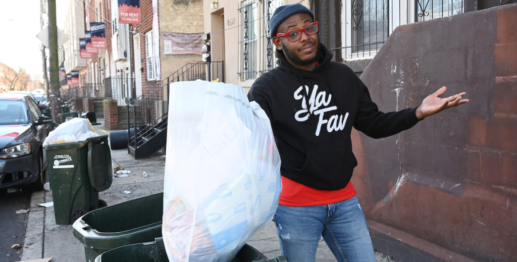 Ya Fav Trashman Terrill Haigler holding a bag of trash