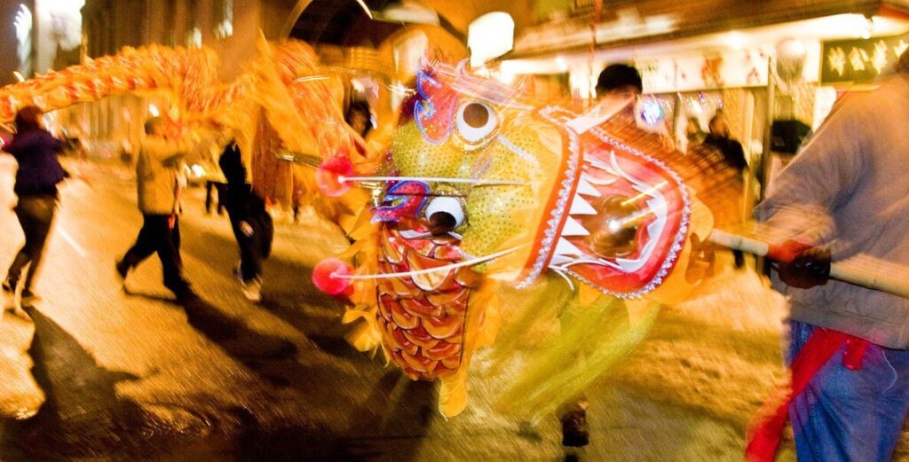 The traditional lion dance is performed in a street in Philadelphia's Chinatown neighborhood to honor the Lunar New Year.