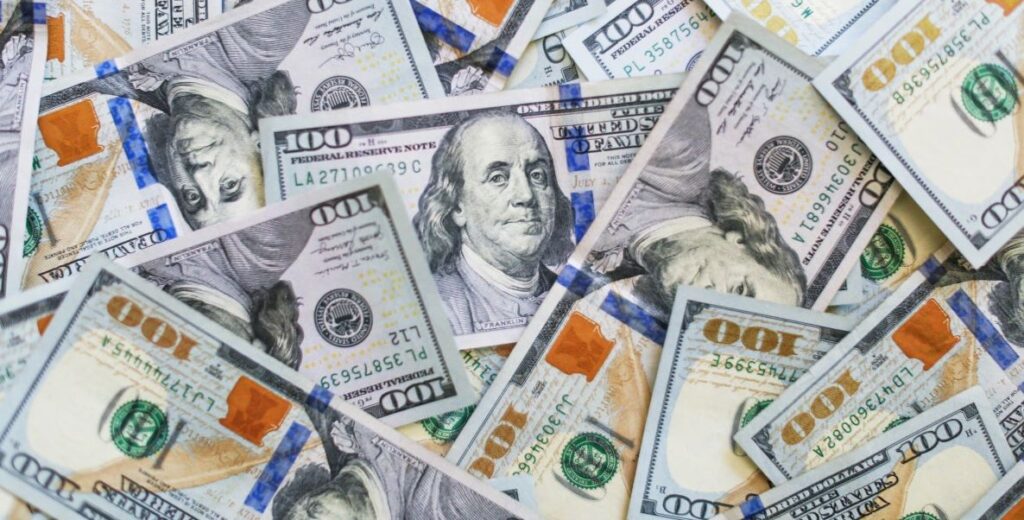 US hundred dollar bills splayed out