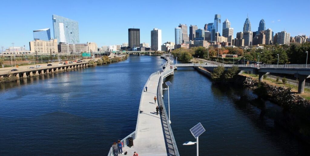 Effective environmental policy results in projects like the Schuylkill Banks Waterfront, where residents and tourists enjoy biking, jogging, and sightseeing along the waterway.