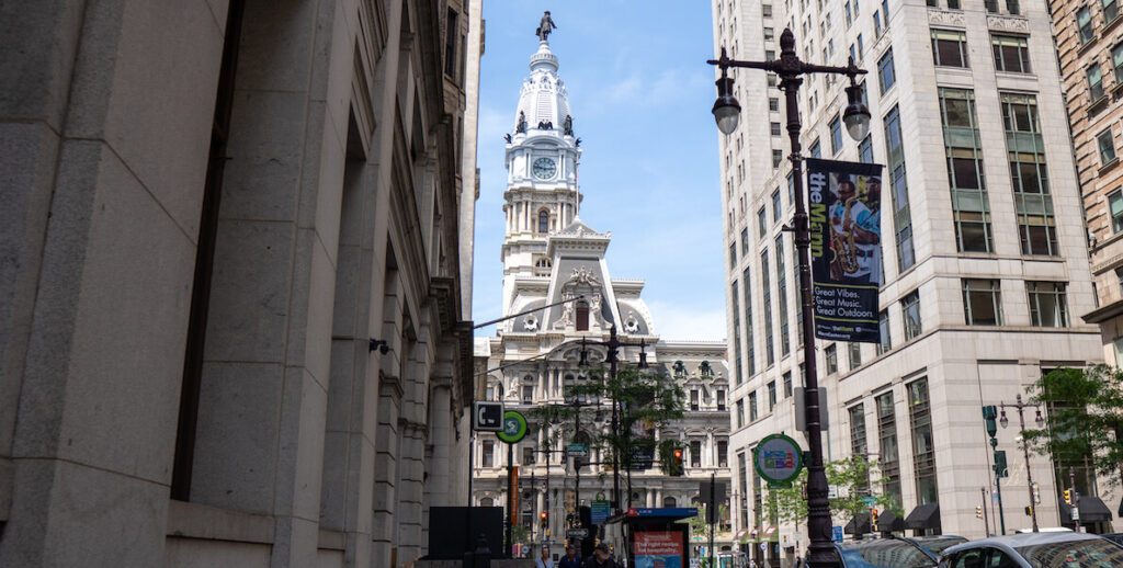 A view of City Hall from between two buildings on Broad Street.