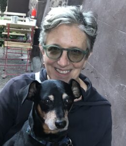 Photo of the artist Sarah McEneaney, with her dog.