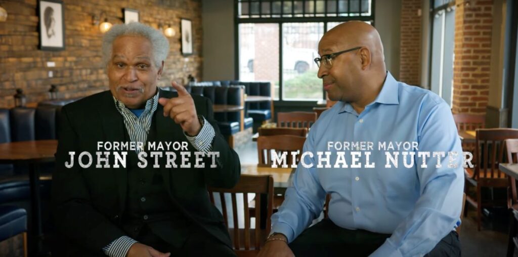 Former Mayors John Street on the left and Michael Nutter on the right in a still from an ad endorsing Rebecca Rhynhart for mayor