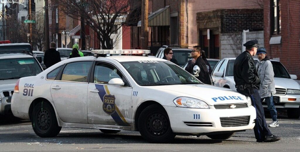 Philadelphia Police Impala parked on the street at the scene of an incident