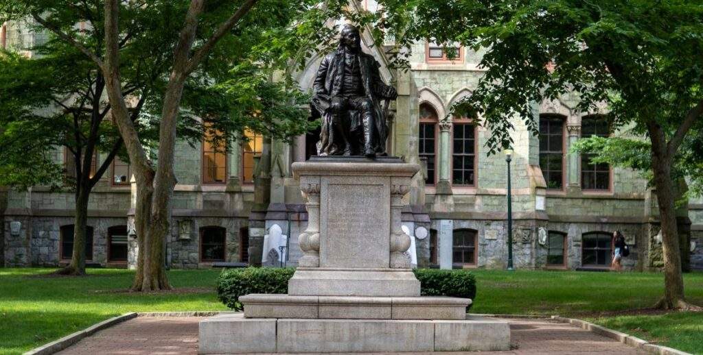 Ben Franklin statute hovers in front of College Hall on UPenn's campus