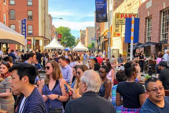 A crowd walks along S. 2nd Street during the Old City Eats Block Party.