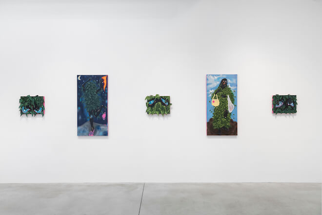 Four paintings by Patricia Renee' Thomas hang side by side on a white gallery wall.
