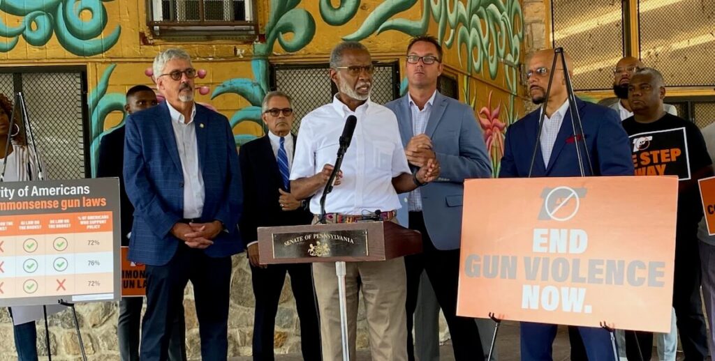 State Senator Art Haywood, center, speaks at a gun violence press conference in Strawberry Mansion in Philadelphia. Behind him is District Attorney Larry Krasner. Alongside him are other state and city leaders.