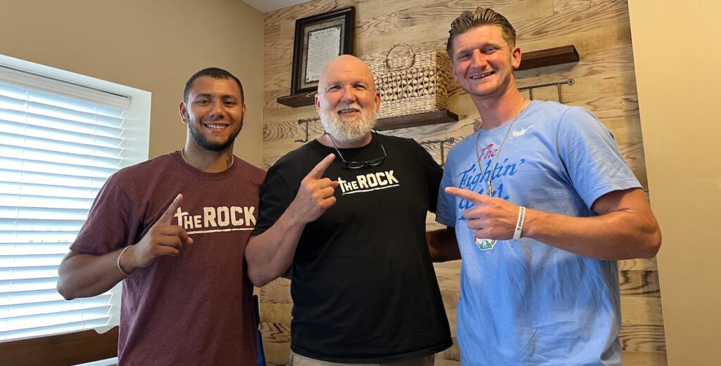 Alex Gonzalez, Pastor Buddy Osborn, and Dave McLaughlin pose at The Rock Ministries.