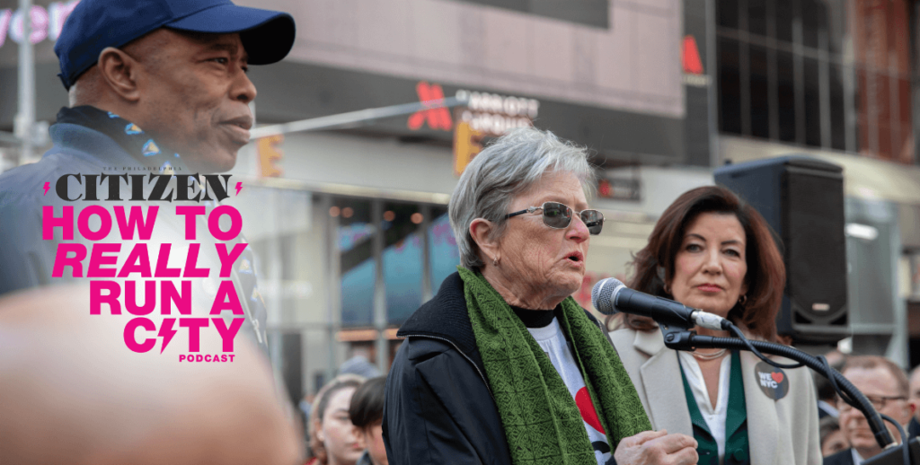 Kathryn Wylde (center) stands alongside New York Mayor Eric Adams.