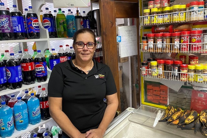 Margarita Collado said she senses that crime is declining in her north Philly community, despite her husband getting into a shootout three months ago with robbers in mini market she manages. Mensah M. Dean for The Trace