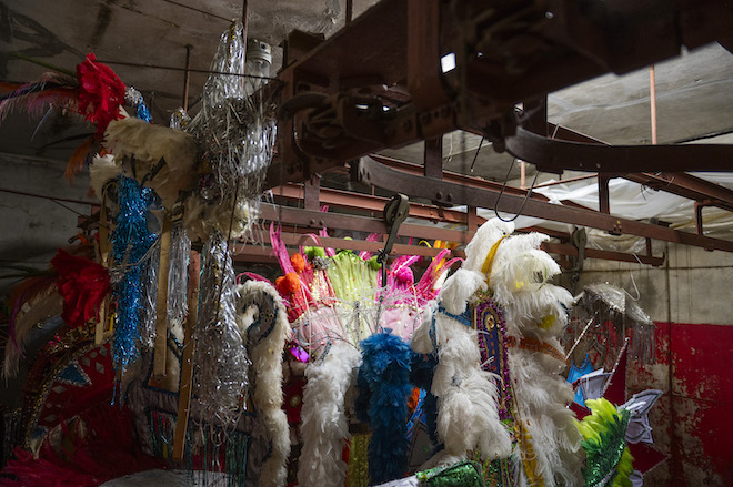 Mummers costumes hang in the Golden Sunrise Fancy Division’s clubhouse, where part of the building used to be a slaughterhouse on Sunday, Dec. 10, 2023.