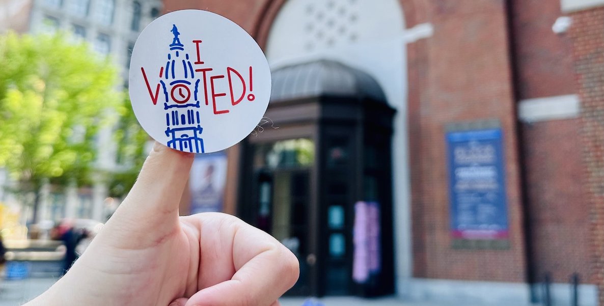 A stuck up thumb shows an "I Voted" sticker from Philadelphia, featuring a drawing of City Hall. Photo courtesy of the City Commissioners' Office.