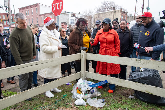 Mayor Cherelle Parker (center) and Carlton Williams (right, in blue jacket, jeans and red cap) on a "Clean and Green" walking tour in February 2024. Photo by Albert Lee.