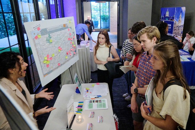 Penn's Lynn Larabi (left) explains the Political Empathy Lab's project to Princeton students.