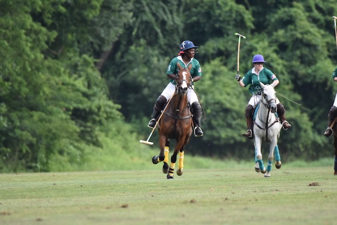 Shariah Harris, a Black polo player, competes among mostly white players in polo, all atop horses, in the Philadelphia Polo Classic.