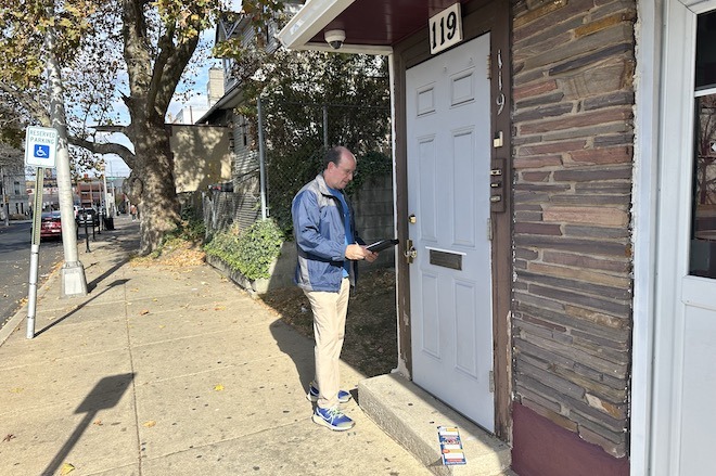 Ken Weinstein knocks on the door of someone who's mail-in ballot was rejected because of an error.