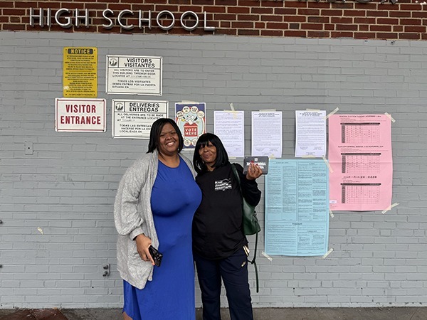 Krystal and Chante (withheld last names) volunteering at the polls at Strawberry Mansion High School.