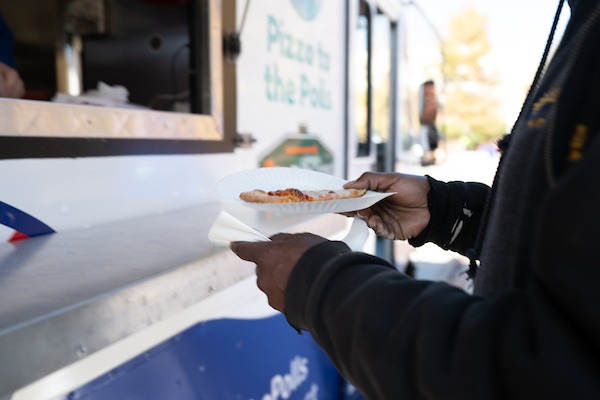 Pizza to the Polls feeding voters outside West Philadelphia High School. By Sabina Louise Pierce.