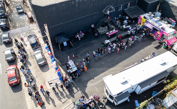 Voters wait in line for platters from Saudia Shuler's Country Cookin' truck on North Broad Street. Shuler offered free soul food platters to anyone who voted — and their kids. By midday, she'd served 1,000. By Sabina Louise Pierce.